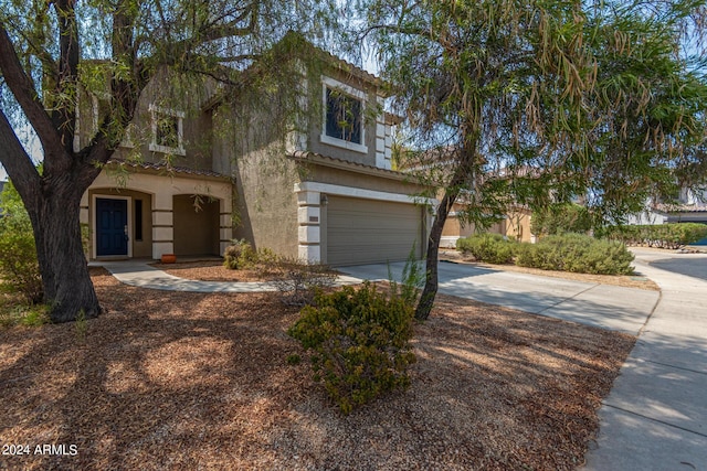 view of front of property with a garage