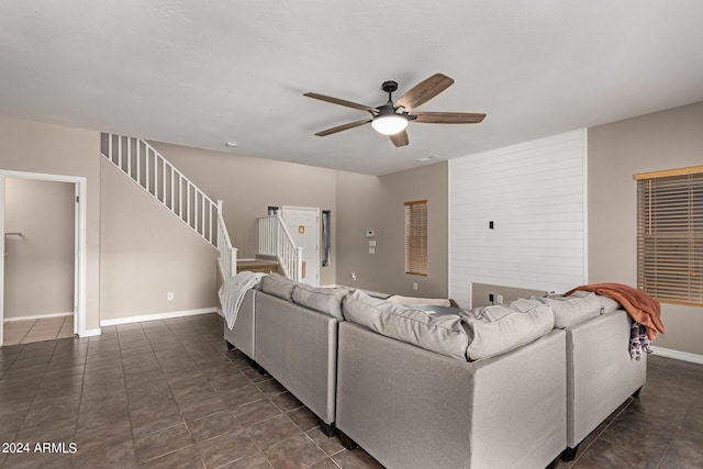 tiled living room featuring ceiling fan