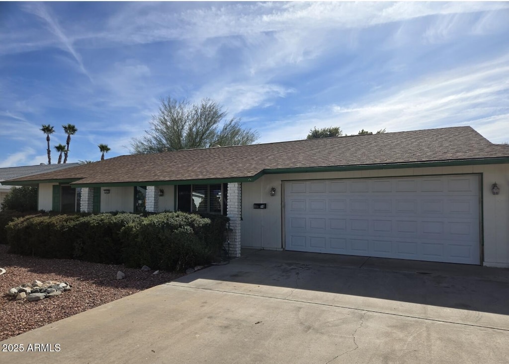 ranch-style house featuring a garage