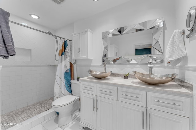 bathroom featuring a shower with curtain, toilet, and vanity