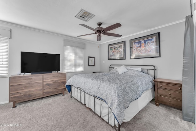 bedroom with ceiling fan, ornamental molding, and multiple windows