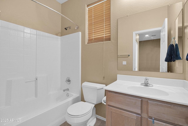 full bathroom featuring toilet, bathtub / shower combination, and vanity