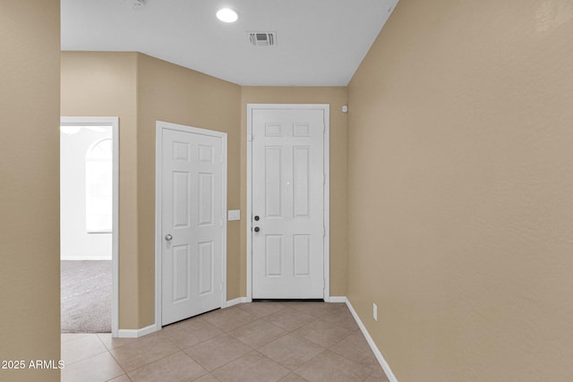 interior space with light tile patterned floors