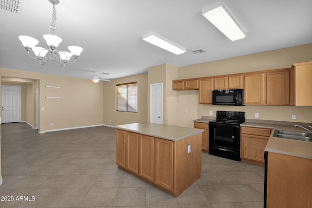 kitchen featuring hanging light fixtures, black appliances, a kitchen island, ceiling fan with notable chandelier, and sink