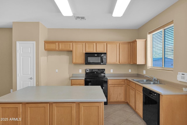 kitchen with light brown cabinetry, light tile patterned floors, black appliances, and sink