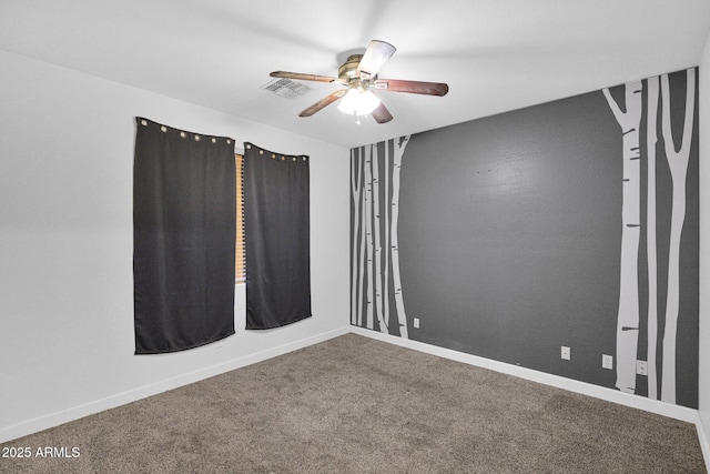 carpeted empty room with ceiling fan