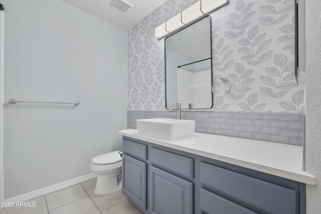 full bathroom featuring visible vents, toilet, vanity, tile patterned flooring, and wallpapered walls