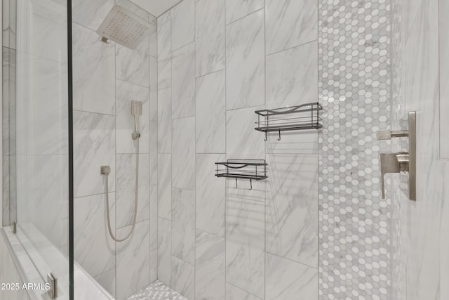 full bath with tiled shower