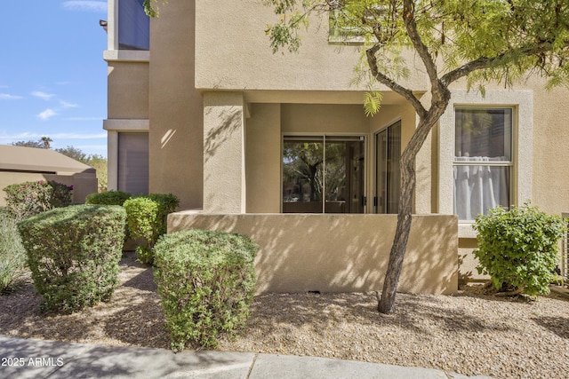 view of side of home featuring stucco siding