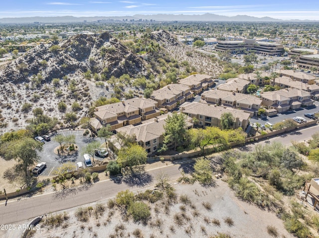 birds eye view of property with a mountain view