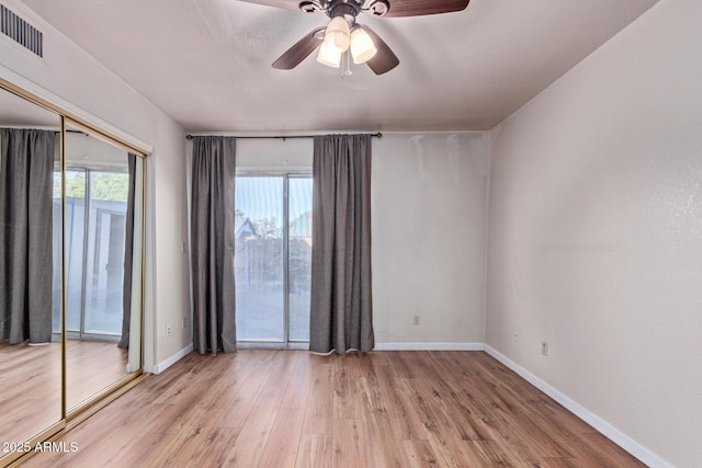 spare room with ceiling fan and light hardwood / wood-style floors