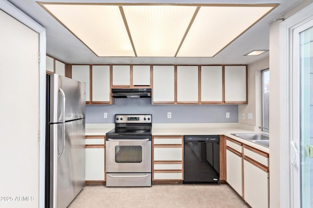 kitchen with white cabinetry, sink, exhaust hood, and appliances with stainless steel finishes