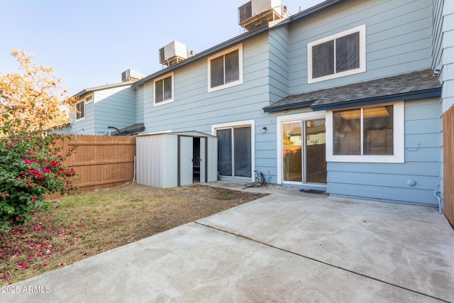 back of property with a patio and central air condition unit