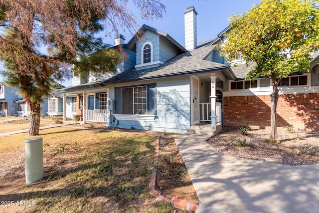 view of front of house featuring a porch and a front lawn