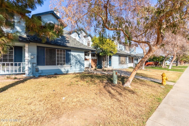 ranch-style home featuring a front lawn