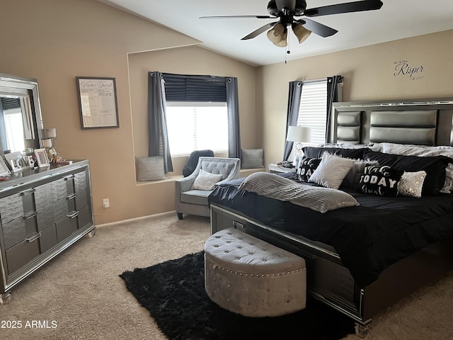 carpeted bedroom with ceiling fan, lofted ceiling, and multiple windows