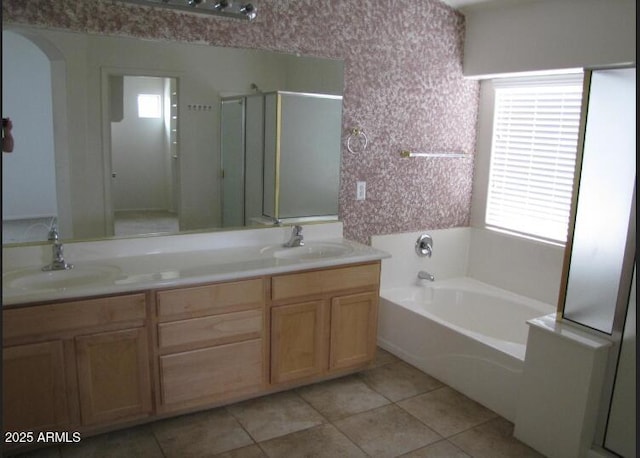 bathroom featuring vanity, tile patterned flooring, and separate shower and tub