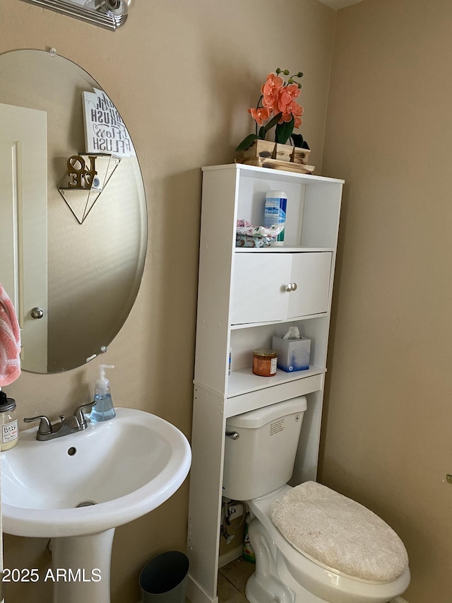 bathroom with toilet and sink