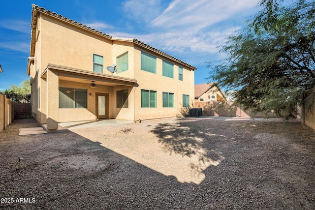 back of property featuring a patio, cooling unit, and ceiling fan