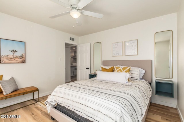 bedroom featuring ceiling fan and light hardwood / wood-style flooring