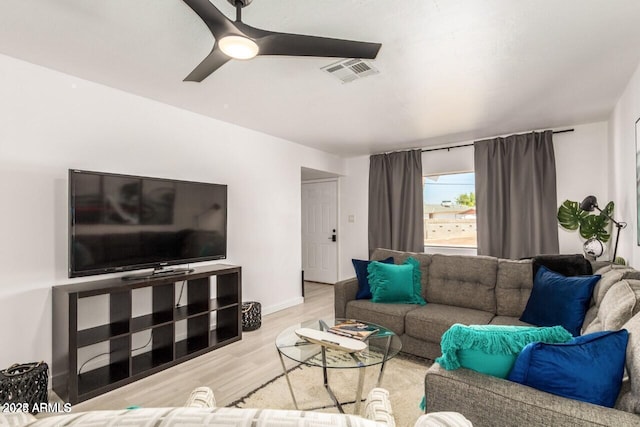 living room with ceiling fan and light hardwood / wood-style floors