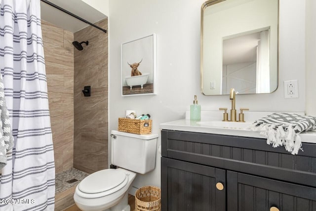 bathroom with vanity, toilet, and a shower with shower curtain