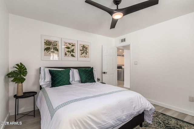 bedroom featuring ceiling fan and light wood-type flooring