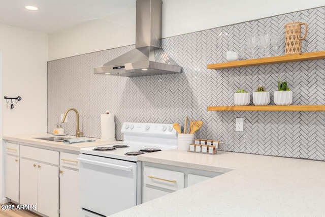 kitchen with sink, exhaust hood, white cabinets, and white range with electric cooktop