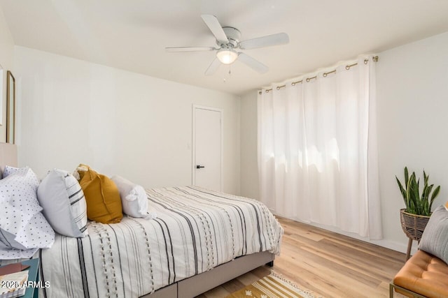 bedroom featuring ceiling fan and light hardwood / wood-style floors