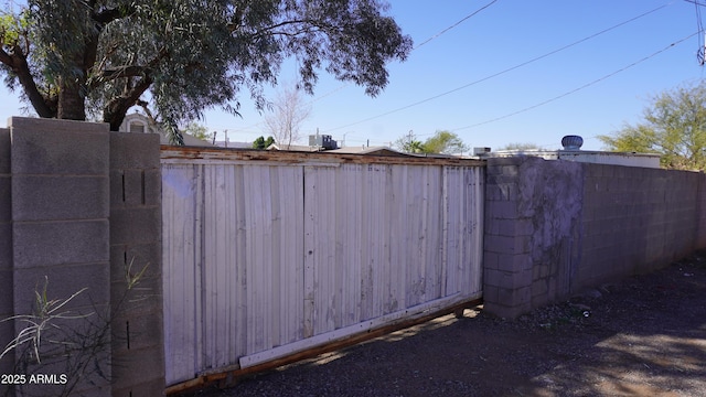 view of gate with fence