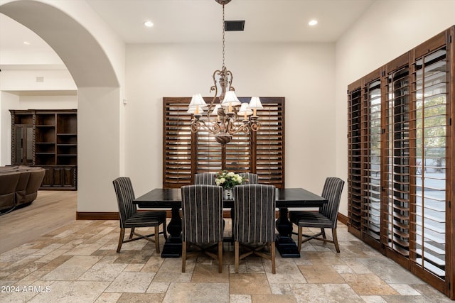 dining space with a notable chandelier