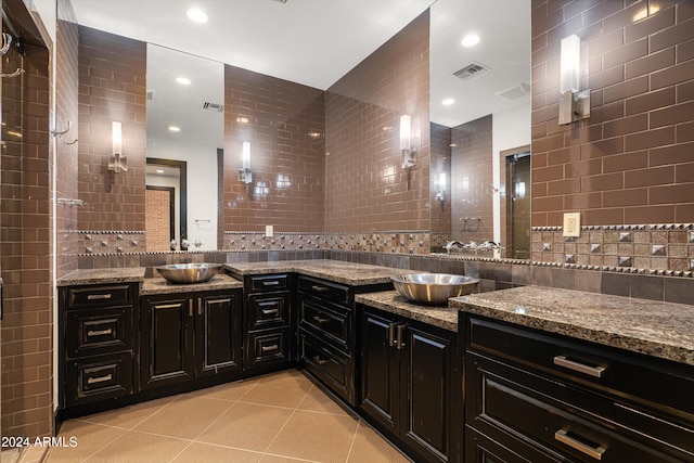 bathroom with tile walls and vanity