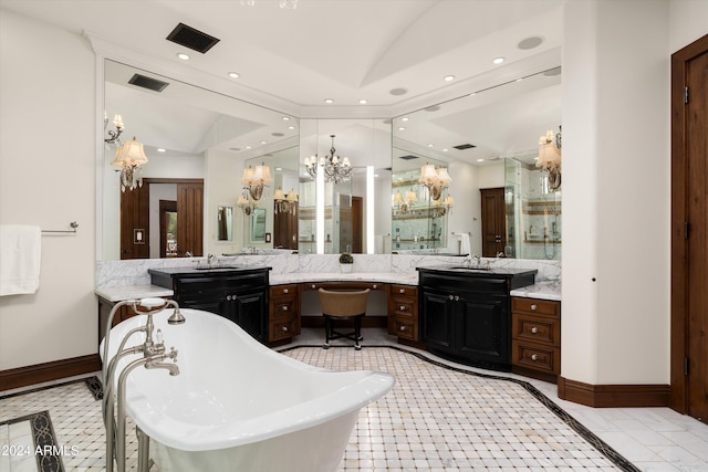 bathroom featuring a bathtub, vanity, and lofted ceiling