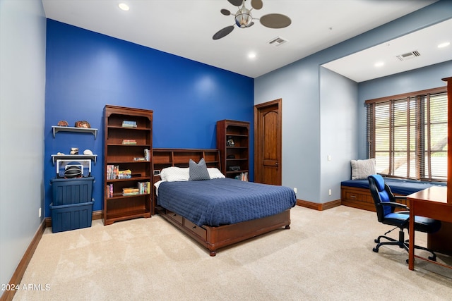 bedroom with ceiling fan and light colored carpet