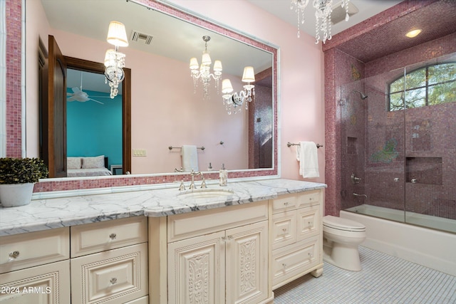 full bathroom with toilet, bath / shower combo with glass door, vanity, a notable chandelier, and tile patterned floors