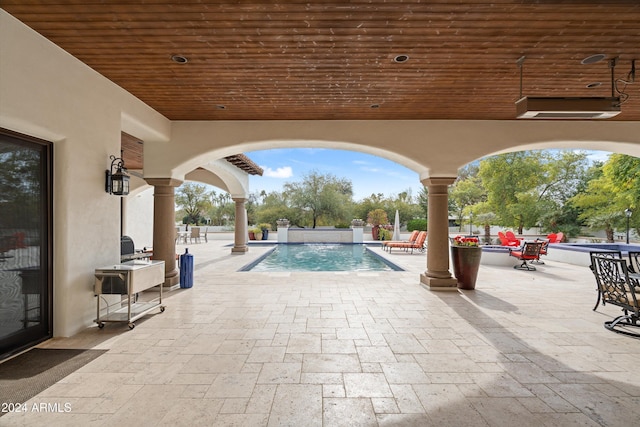 view of pool featuring a patio