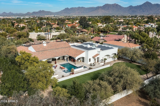 birds eye view of property with a mountain view