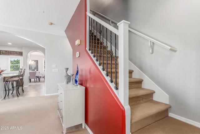 905 S Osborn Ln, Gilbert, AZ 85296 - stairs with arched walkways and carpet floors