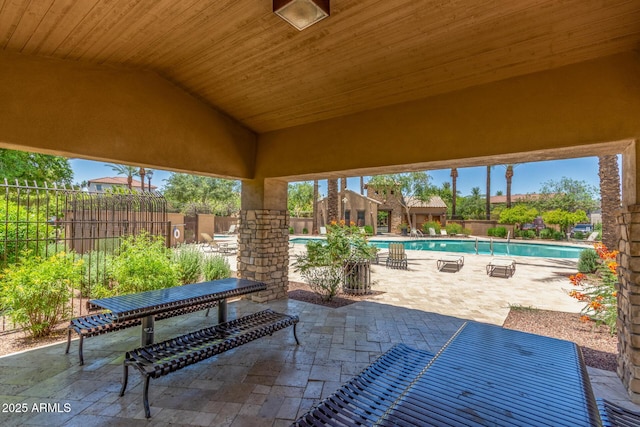 905 S Osborn Ln, Gilbert, AZ 85296 - fenced backyard with a patio area and a community pool