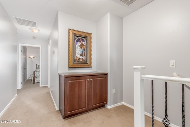 905 S Osborn Ln, Gilbert, AZ 85296 - corridor featuring light carpet and an upstairs landing