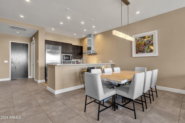 tiled dining area with sink