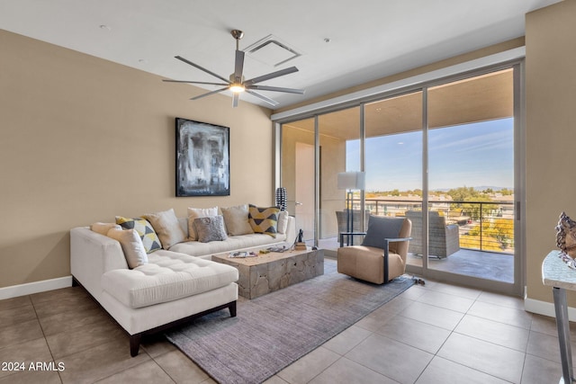 living room featuring ceiling fan and light tile floors