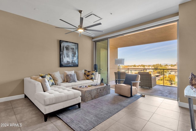 living room with light tile flooring and ceiling fan