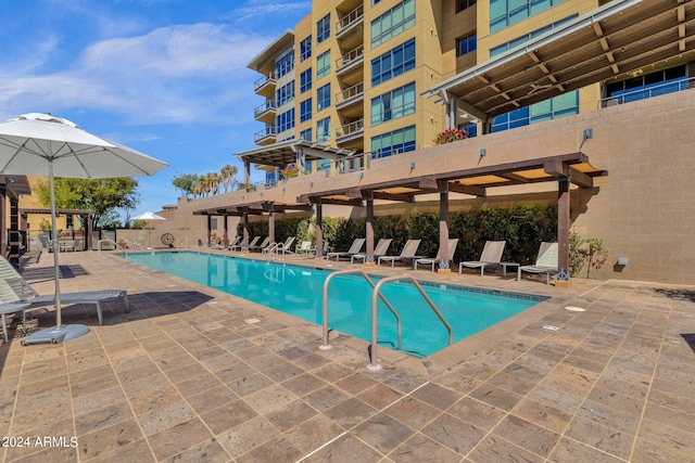 view of pool featuring a pergola and a patio area