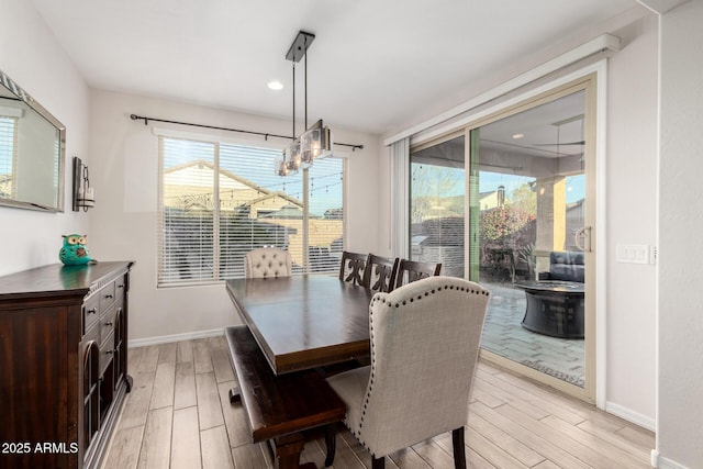 dining room featuring baseboards and wood finish floors