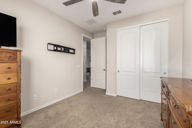 unfurnished bedroom with baseboards, visible vents, ceiling fan, carpet flooring, and a closet