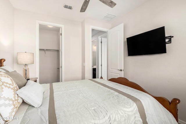 bedroom with ceiling fan, visible vents, and a closet