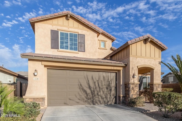 traditional-style house with concrete driveway, a tile roof, an attached garage, fence, and stucco siding