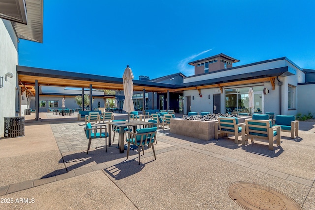 view of patio with a fire pit