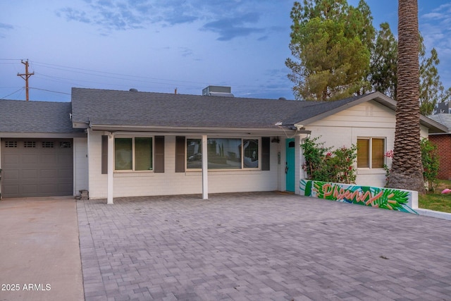 single story home with a garage